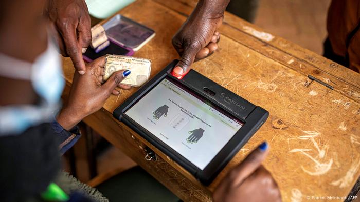 An election official verifies voters' information on the Kenya Integrated Electoral Management System (KIEMS).