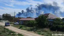 Smoke rises after explosions were heard from the direction of a Russian military airbase near Novofedorivka, Crimea August 9, 2022. REUTERS/Stringer
