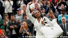 US tennis star Serena Willimas waves at the crowd as she leaves the court