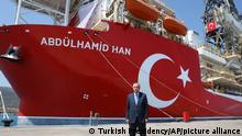 In this photo provided by the Turkish Presidency, Turkey's President Recep Tayyip Erdogan stands in front of Abdulhamid Han ship, in Mersin, Turkey, Tuesday, Aug. 9, 2022. Erdogan inaugurated the country's newest and largest undersea hydrocarbon drill ship Tuesday that he said would head for a spot northwest of Cyprus in the eastern Mediterranean, which is not claimed by any other country. Turkey is embroiled in acrimonious disputes with Greece and Cyprus over maritime boundaries and offshore energy rights, which triggered high tensions in the eastern Mediterranean two years ago. (Turkish Presidency via AP)