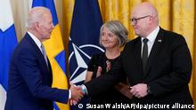 President Joe Biden shakes hands with Mikko Hautala, Finland's ambassador to the U.S., as he speaks with Hautala and Karin Olofsdotter, Sweden's ambassador to the U.S., after signing the Instruments of Ratification for the Accession Protocols to the North Atlantic Treaty for the Republic of Finland and Kingdom of Sweden in the East Room of the White House in Washington, Tuesday, Aug. 9, 2022. The document is a treaty in support of Sweden and Finland joining NATO. (AP Photo/Susan Walsh)