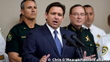 Florida Gov. Ron DeSantis gestures as he speaks during a news conference Thursday, Aug. 4, 2022, in Tampa, Fla. DeSantis announced that he was suspending State Attorney Andrew Warren, of the 13th Judicial Circuit, due to neglect of duty. (AP Photo/Chris O'Meara)