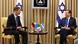 Steffen Seibert and Israeli President Isaac Herzog sitting with a small table between them Steffen Seibert and Israeli President Isaac Herzog sitting with a small table between them