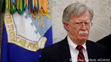 US National Security Advisor John Bolton stands near by as President Donald Trump meets with Danny Burch, a former hostage in Yemen, in the Oval Office at the White House March 6, 2019 in Washington, DC. Photo by Ting Shen/ABACAPRESS.COM