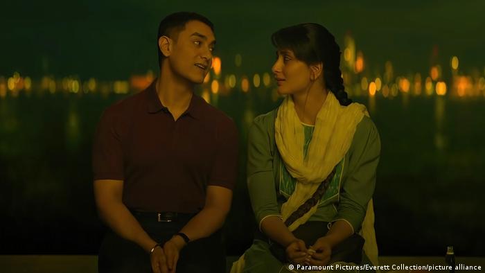 In one scene of the film Laal Singh Chaddha, a man and a woman are sitting on the bank of a river.