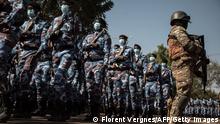 Malian Military personnel parade in front of the heads of the transitional government during a ceremony celebrating the army's national day, in Kati, on January 20, 2022. - With the support of French, European and Russian partners, the Malian army is trying to regain the territories occupied by armed groups and jihadists. (Photo by FLORENT VERGNES / AFP) (Photo by FLORENT VERGNES/AFP via Getty Images)