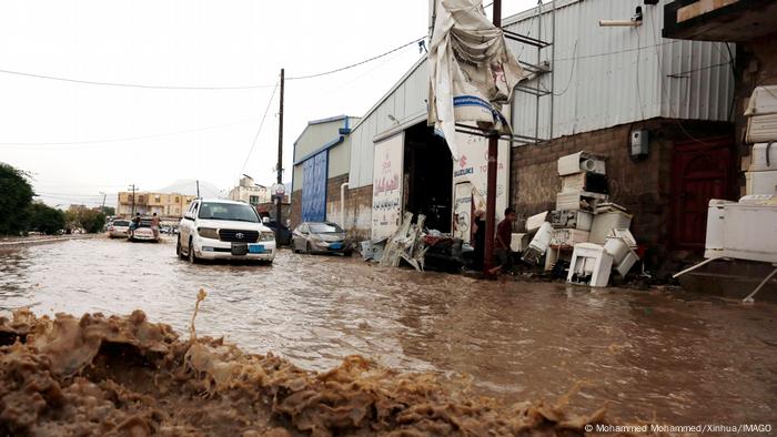 Vehicles on a flooded street after heavy rain in Sanaa, Yemen