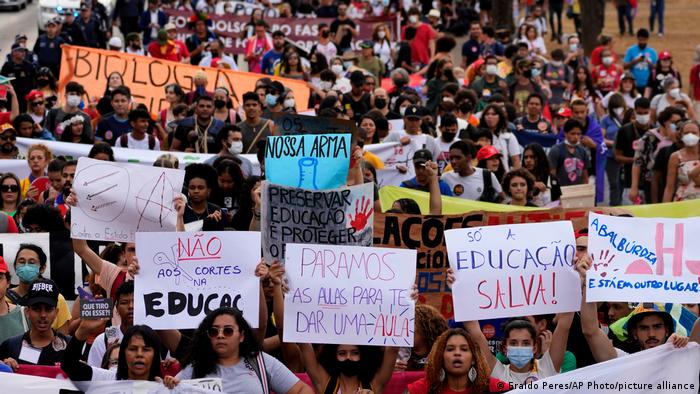 Protesters holding signs in Brasilia