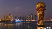 World Cup replica in front of Doha's skyline 