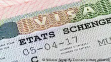 European schengen visa in passport - travel background