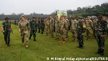 Indonesia's Commander of the National Armed Forces General Andika Perkasa and U.S. Army Pacific Commanding General Charles Flynn walk as they inspect the troops during the opening of the Super Garuda Shield joint military training exercise in Baturaja, South Sumatra province, Indonesia, August 3, 2022 in this photo taken by Antara Foto. Antara Foto/M Risyal Hidayat/ via REUTERS ATTENTION EDITORS - THIS IMAGE WAS PROVIDED BY A THIRD PARTY. MANDATORY CREDIT. INDONESIA OUT.