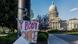 A sign reading "My body, my Choice," is taped to a hanger taped to a streetlight in front of the Idaho State Capitol Building A sign reading "My body, my Choice," is taped to a hanger taped to a streetlight in front of the Idaho State Capitol Building
