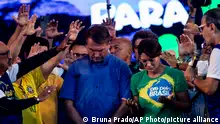 Brazil's President Jair Bolsonaro and his wife, first lady Michelle Bolsonaro, participate in a prayer during the annual Christian event March for Jesus, in Rio de Janeiro, Brazil, Saturday, Aug. 13, 2022. (AP Photo/Bruna Prado)