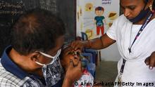 27.02.2022
A health worker (R) administers oral polio vaccine to a child during a vaccination drive as a part of an ongoing polio eradication program in Chennai on February 27, 2022. (Photo by Arun SANKAR / AFP) (Photo by ARUN SANKAR/AFP via Getty Images)
