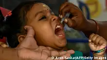 27.02.2022
A health worker administers oral polio vaccine to a child during a vaccination drive as a part of an ongoing polio eradication program in Chennai on February 27, 2022. (Photo by Arun SANKAR / AFP) (Photo by ARUN SANKAR/AFP via Getty Images)