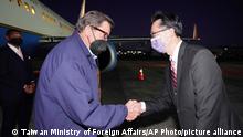 In this photo released by the Taiwan Ministry of Foreign Affairs, from left, U.S. Democratic House members John Garamendi shakes hands with Donald Yu-Tien Hsu, Director-General, dept. of North American Affairs, Taiwan's Ministry of Foreign Affairs after arriving on a U.S. government plane at Songshan airport in Taipei, Taiwan on Sunday, Aug 14, 2022. The delegation of American lawmakers are visiting Taiwan just 12 days after a visit by U.S. House Speaker Nancy Pelosi that angered China. (Taiwan Ministry of Foreign Affairs via AP)
