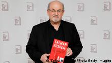 British author Salman Rushdie poses with his book 'Quichotte' during the photo call for the authors shortlisted for the 2019 Booker Prize for Fiction at Southbank Centre in London on October 13, 2019. (Photo by Tolga AKMEN / AFP) (Photo by TOLGA AKMEN/AFP via Getty Images)
