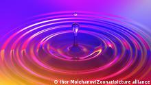 Colorful liquid drop or paint drop falling on color surface. Rainbow colored ripple splash of dye, macro image. Graphic design element for poster, package, flyer. Abstract background, 3D illustration