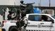 Un vehículo de la Guardia Nacional con agentes fuertemente armados. Un vehículo de la Guardia Nacional con agentes fuertemente armados.