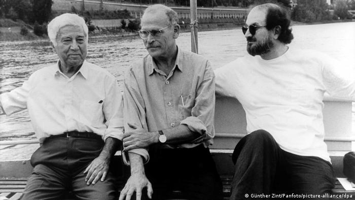 Writers Günter Wallraff, Salman Rushdie and Aziz Nesin sitting on a boat on the Rhein in Cologne, Germany