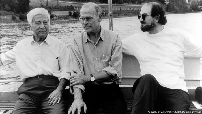 Writers Günter Wallraff, Salman Rushdie and Aziz Nesin sitting on a boat on the Rhein in Cologne, Germany