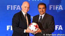 FIFA President Gianni Infantino, left, holds a soccer ball with All India Football Federation (AIFF) President Praful Patel during a press conference in Kolkata, India, Friday, Sept. 27, 2017. The finals of the FIFA U-17 World Cup India 2017 will be played between Spain and England on Saturday. (AP Photo)