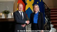 German Chancellor Olaf Scholz is welcomed by Swedish Prime Minister Magdalena Andersson to the Sagerska palace in Stockholm, Tuesday, Aug. 16, 2022. (Henrik Montgomery/TT News Agency via AP)