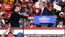 FILE - Former President Donald Trump endorses Harriet Hageman for Wyoming's U.S. House seat during a rally on Saturday, May 28, 2022, at the Ford Wyoming Center, in Casper, Wyo. Hageman finished in the middle of a five-way, 2018 Republican gubernatorial primary. She's campaigned aggressively for Rep. Liz Cheney's House seat, appearing at county fairs, parades and rodeos. (Lauren Miller/The Casper Star-Tribune via AP, File)