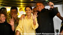 Brazilian President who is running for reelection, Jair Bolsonaro, and his wife Michelle hold a campaign rally in Juiz de Fora, Minas Gerais state, Brazil, Tuesday, Aug. 16, 2022. Bolsonaro formally began his campaign for re-election in this town where he was stabbed during his 2018 campaign. General elections are set for Oct. 2. (AP Photo/Silvia Izquierdo)
