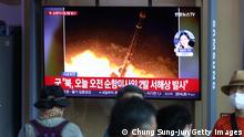 SEOUL, SOUTH KOREA - AUGUST 17: People watch a television screen showing a file image of a North Korean missile launch at the Seoul Railway Station on August 17, 2022 in Seoul, South Korea. North Korea test-fired two cruise missiles toward the Yellow Sea on Wednesday, a South Korean military official said, as President Yoon Suk-yeol held a press conference to mark the 100th day since taking office. (Photo by Chung Sung-Jun/Getty Images)