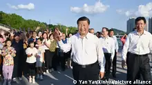 (220817) -- JINZHOU, Aug. 17, 2022 (Xinhua) -- Chinese President Xi Jinping, also general secretary of the Communist Party of China Central Committee and chairman of the Central Military Commission, waves to citizens while visiting a forest park in Jinzhou, northeast China's Liaoning Province, Aug. 16, 2022. (Xinhua/Yan Yan)