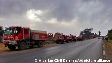SETIF, ALGERIA - AUGUST 17: (----EDITORIAL USE ONLY Äì MANDATORY CREDIT - ALGERIAN CIVIL DEFENCE / HANDOUT - NO MARKETING NO ADVERTISING CAMPAIGNS - DISTRIBUTED AS A SERVICE TO CLIENTS----) Fire trucks are seen during the firefighters intervene by land to control a wildfire in Setif, Algeria on August 17, 2022. In a statement on Algerian official television, Algerian Interior Minister Kemal Belcud stated that the air temperatures exceeded 47 degrees and forest fires have occurred in 106 different points in many cities since the beginning of August. 26 people have died in forest fires to date. Algerian Civil Defense / Handout / Anadolu Agency