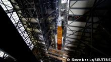 NASA's next-generation moon rocket, the Space Launch System (SLS) Artemis 1 rocket with its Orion crew capsule begins its roll to launch pad 39B at the Kennedy Space Center in Cape Canaveral, Florida, U.S. August 16, 2022. REUTERS/Steve Nesius