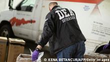 Prescriptions drugs collected during the Drug Enforcement Administration (DEA)s Take Back Day event are placed into plastic bags in White Plains, New York on April 24, 2021. (Photo by Kena Betancur / AFP) (Photo by KENA BETANCUR/AFP via Getty Images)