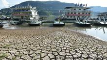 Piers are seen near the dried riverbed exposed after the water level dropped in the Yangtze River in Yunyang county in southwest China's Chongqing Municipality Tuesday, Aug. 16, 2022. Unusually high temperatures and a prolonged drought are affecting large swaths of China, reducing crop yields and drinking water supplies. (Chinatopix Via AP) CHINA OUT