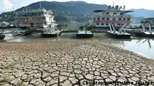 Piers are seen near the dried riverbed exposed after the water level dropped in the Yangtze River in Yunyang county in southwest China's Chongqing Municipality Tuesday, Aug. 16, 2022. Unusually high temperatures and a prolonged drought are affecting large swaths of China, reducing crop yields and drinking water supplies. (Chinatopix Via AP) CHINA OUT