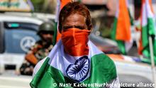 A Kashmiri man wraps his face in Indian National Flag Tri-Color during Tiranga Rally. BJP workers held Tri-Color (Tiranga) Rally in Baramulla Jammu and Kashmir India on 10 August 2022. Party workers including senior leaders like Sunil Sharma, Anwar Khan, Mushtaq Nowsheri Took Part in the Har Ghar Tiranga Initiative Lead by Prime Minister Narendra Modi. (Photo by Nasir Kachroo/NurPhoto)
