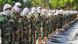 Somalia's al-Shabab fighters in camouflage clothes conduct Muslim prayers outside. Somalia's al-Shabab fighters in camouflage clothes conduct Muslim prayers outside.