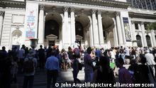 Supporters of author Salman Rushdie gathered on the steps of the main branch of the New York public library for a rally held in support of Salman Rushdie following last week's attack 
