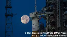 August 14, 2022, Cape Canaveral, Florida, USA: A full Moon is in view from Launch Complex 39B at NASA's Kennedy Space Center in Florida. The Artemis I Space Launch System (SLS) and Orion spacecraft, atop the mobile launcher, are being prepared for a wet dress rehearsal to practice timelines and procedures for launch. The first in an increasingly complex series of missions, Artemis I will test SLS and Orion as an integrated system prior to crewed flights to the Moon. Through Artemis, NASA will land the first woman and first person of color on the lunar surface, paving the way for a long-term lunar presence and using the Moon as a steppingstone on the way to Mars. (Credit Image: © Ben Smegelsky/NASA via ZUMA Press Wire