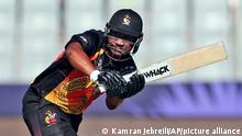 Papua New Guinea's captain Assad Vala, right, bats during the Cricket Twenty20 World Cup first round match between Oman and Papua New Guinea in Muscat, Oman, Sunday, Oct. 17, 2021. (AP Photo/Kamran Jebreili)