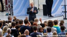 German Chancellor Olaf Scholz speaks as he meets visitors at the grounds of the chancellery during the government's Open House Day in Berlin, Germany, August 21, 2022. REUTERS/Michele Tantussi