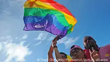 (170701) -- SINGAPORE, July 1, 2017 () -- People wave a rainbow flag during the Pink Dot event held in Singapore's Hong Lim Park on July 1, 2017. The annual Pink Dot event which supports lesbian, gay, bisexual and transexual (LGBT) people was held on Saturday. (/Then Chih Wey)(whw)