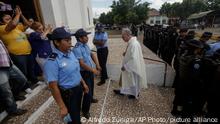 14.11.2019
Father Edwin Roman returns to his church after he failed to convince the police to allow relatives of imprisoned and dead anti-government demonstrators to enter the San Miguel Arcangel Church in Masaya, Nicaragua, Thursday, Nov. 14, 2019. The relatives have started a hunger strike to demand the freedom of their relatives, jailed for protesting against the government of President Daniel Ortega. (AP Photo/Alfredo Zuniga)