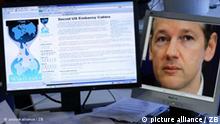 ILLUSTRATION - Die Internetseite von Wikileaks mit den Veröffentlichungen vertraulicher Depeschen von US-Diplomaten ist am Dienstag (30.11.2010) in Schwerin auf einem Computermonitor zu sehen. Auf einem zweiten Computermonitor ist ein Foto von Wikileaks-Gründer Julian Assange zu sehen. Die Internetplattform plant wohl schon den nächsten Coup: Anfang nächsten Jahres solle eine amerikanische Großbank zum Ziel werden, sagte Assange in einem Interview des US-Magazins «Forbes», das am Montag (Ortszeit) online veröffentlicht wurde. Foto: Jens Büttner