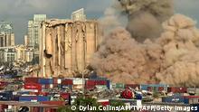 This grab from AFPTV footage shot on August 23, 2022 shows a smoke plume rising after the new collapse of the northern section of the grain silos at the port of Lebanon's capital Beirut, which were previously partly destroyed by the 2020 port explosion. (Photo by Dylan COLLINS / AFPTV / AFP) (Photo by DYLAN COLLINS/AFPTV/AFP via Getty Images)