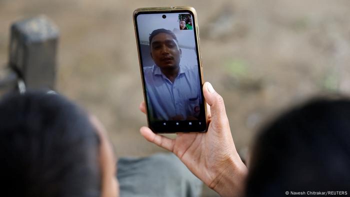 Parwati Sunar and her son make a video call to her husband and father, who is over 2000 km away.