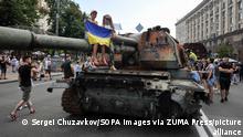 August 21, 2022, Kyiv, Ukraine: People inspect the destroyed equipment of the Russian army on Khreshchatyk in the center of Kyiv. Ukrainians will celebrate the 31st anniversary of Independence Day on August 24, 2022. Russia invaded Ukraine on 24 February 2022, triggering the largest military attack in Europe since World War II. (Credit Image: © Sergei Chuzavkov/SOPA Images via ZUMA Press Wire