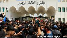 23.08.2022****Supporters of Iraqi populist leader Moqtada al-Sadr gather for a sit-in in front of the gate of Supreme Judicial Council of Iraq, amid political crisis in Baghdad, Iraq August 23, 2022. REUTERS/Thaier Al-Sudani