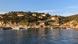 View back onto the Ile du Levant, France, taken on a boat at sunset. View back onto the Ile du Levant, France, taken on a boat at sunset.